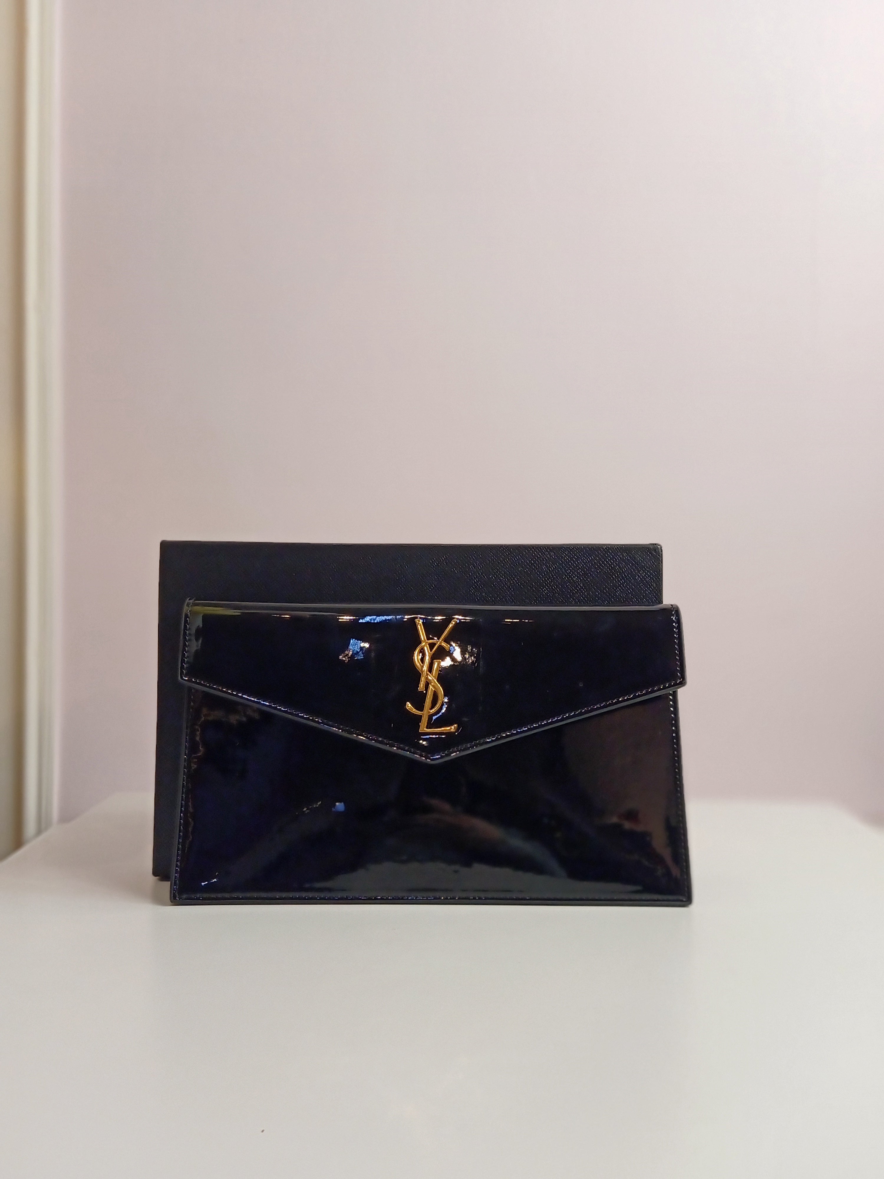 YSL clutch in shiny black-gold