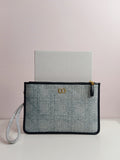 Dior clutch in light blue jeans