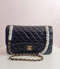 Chanel medium classic flap in black-gold