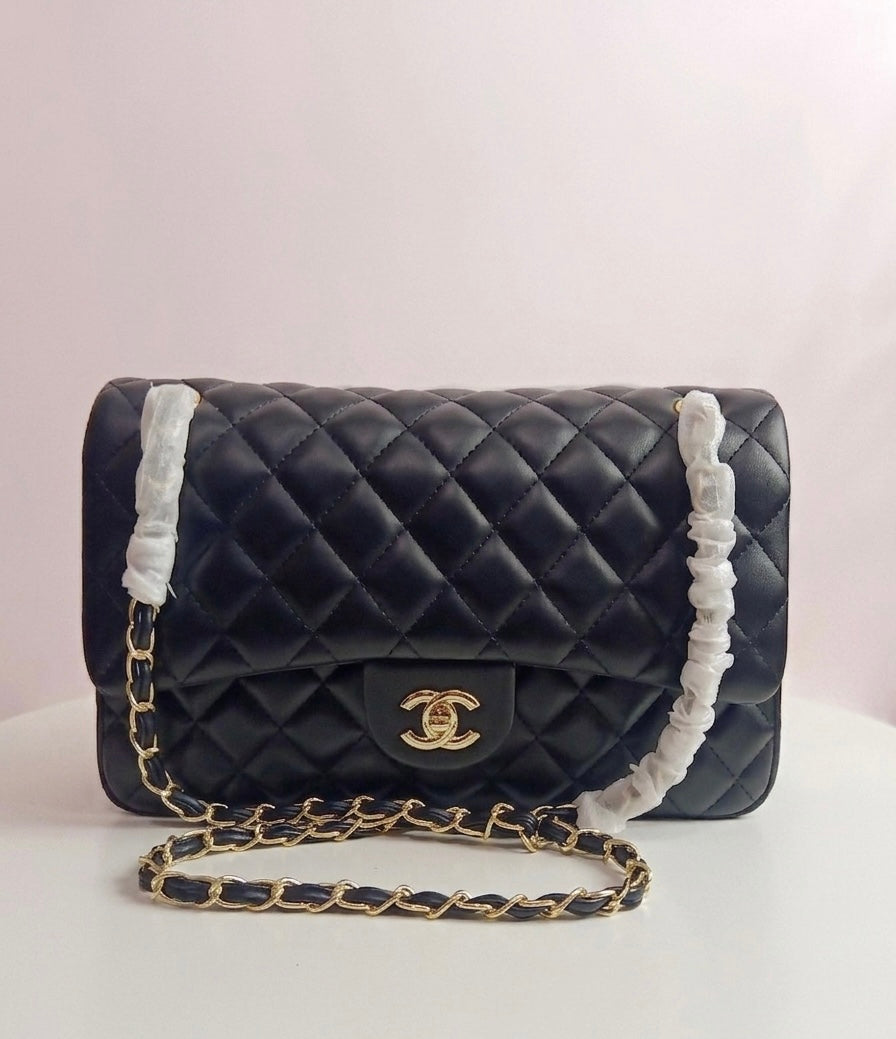 Chanel medium classic flap in black-gold