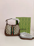 Gucci small cross body bag in brown