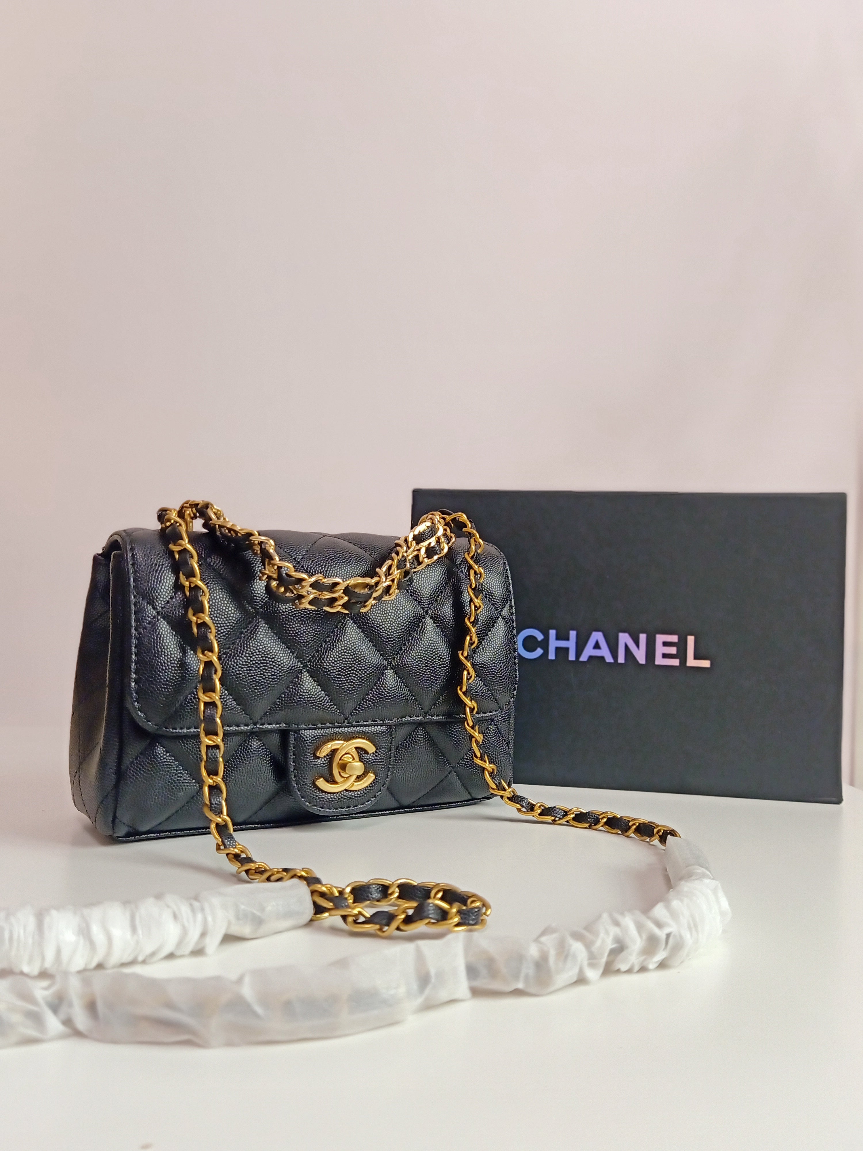 Chanel small classic flap in black-gold